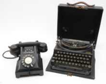 A Remington 'Home Portable' typewriter in black case,