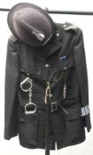 A 20th century police tunic with Northumbria Police helmet: together with handcuffs,