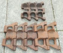 Two sections of WWII armoured vehicle track links: the larger of five sections, 33.