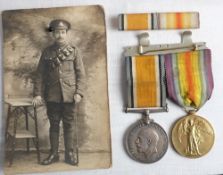 A WWI pair to '177830 Dvr E A Lane RA': together with ribbon bar and photograph of recipient in a