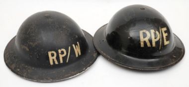 Two WWII Repair Party Mk II steel helmets: both in black,