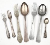 A group of WWII German mess cutlery: comprising a Kriegsmarine spoon, an SS Waffen fork,