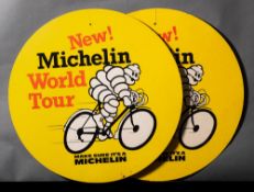 Two Michelin 'New World Tour' double sided cardboard bicycle advertising signs: depicting Bibendum