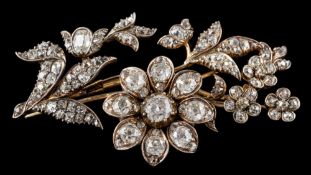 A 19th century diamond mounted tremblant floral spray brooch: with principal flower head tremblant