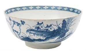 A First Period Worcester blue and white bowl: painted in 'The Precipice' pattern of buildings and a