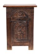 A Spanish carved oak pedestal cupboard:, with a rectangular plain top,