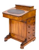 A Victorian walnut and inlaid davenport:,