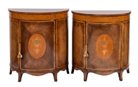 A near pair of mahogany, satinwood and marquetry half round side cabinets:,