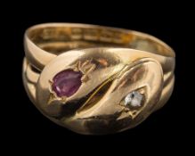 An 18 carat gold diamond and ruby snake ring: designed as two snakes set with an old cut diamond