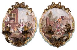 A pair of French faience wall sconces: of shaped oval form with gilt-metal ribbon tied mounts and
