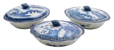 A group of three Chinese blue and white shaped oval vegetable tureens and matched covers: with