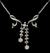 A late 19th/early 20th century diamond mounted negligee necklace: with central round old