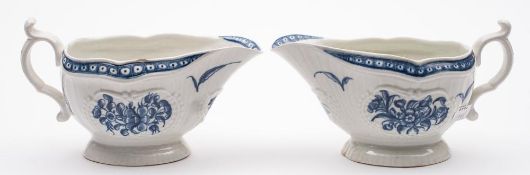 A pair of First Period Worcester blue and white sauceboats: each of strap-fluted form with double