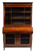 A Regency rosewood and brass marquetry piano type bureau bookcase:,