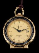 Gucci, a quartz world alarm travel clock: the gold coloured dial with Roman numerals,