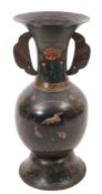 A large Chinese cloisonne vase: of ovoid form with flared rim, winged handles on a domed foot,