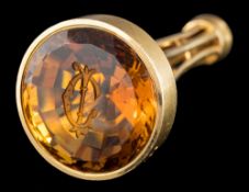 A late Victorian 18 carat gold citrine set seal by Bishton and Fletcher: the circular shaped