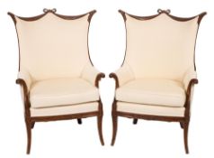 A pair of Edwardian carved and stained beech armchairs:,