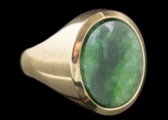 An oval nephrite single-stone ring: the shank stamped '585', approximately 14.