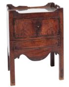 A George III mahogany converted tray top commode:, the ledge gallery with carrying handles,
