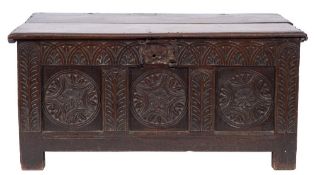 An early 18th Century oak rectangular coffer:, with a plain hinged moulded top,
