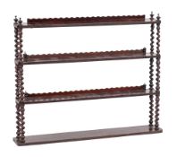 A Victorian rosewood four tier hanging bookcase:, with shaped ledge galleries,