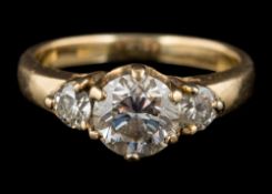 A diamond three-stone ring, the central brilliant cut diamond, estimated to weigh 0.