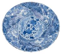 A large Chinese blue and white 'pheonix and monkey' charger: of spiral moulded form,