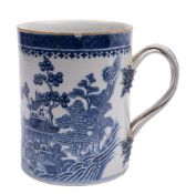 A Chinese blue and white mug: of cylindrical form with plaited handle and leafy terminals,