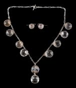 A faceted quartz crystal necklace: with ten spherical drops each approximately 14.