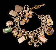 A 9ct gold curb link charm bracelet: the curb link bracelet with twenty one attached charms,