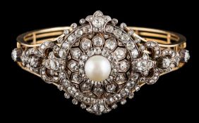 A late 19th century diamond and pearl circular cluster brooch/bangle: the central pearl measuring
