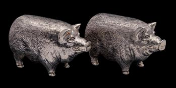 A pair of Continental silver novelty condiments, stamped 800: in the form of pigs, 6.
