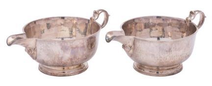 A pair of George V hammered silver sauceboats, maker Tessier Ltd, London,