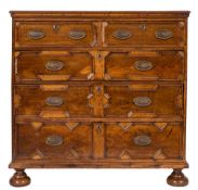 An 18th Century oak and fruitwood rectangular chest:, the top with a moulded edge,