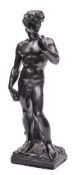 After Michelangelo A Grand Tour bronze study of David: standing on a naturalistic rectangular base,