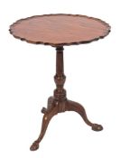 A mahogany circular pie crust occasional table in the Georgian taste:,