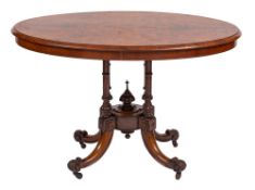 A Victorian walnut oval breakfast table:,