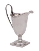 A George V silver cream jug, maker William Aitken, Birmingham, 1916: of helmet-shaped outline,