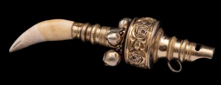 A child's silver-gilt rattle, maker MC, remaining marks worn: with whistle,