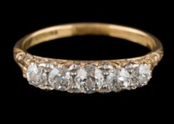 A late 19th century gold and diamond five-stone half-hoop ring: with graduated cushion-shaped old