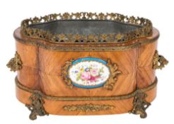 A 19th Century French kingwood and gilt metal and porcelain mounted table jardiniere:,