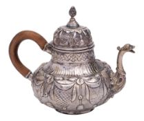 A 19th century Dutch silver teapot, marks worn: with domed hinged lid,