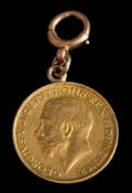 A George V sovereign dated 1913: mounted as a pendant with bolt ring clasp attached.