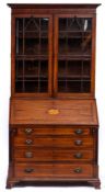 A George III mahogany and inlaid bureau and associated bookcase:,