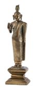 A Sri Lankan solid-cast bronze standing figure of Buddha: with flame shaped crown,