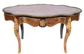 A 19th Century French ebonised and Boulle work gilt metal mounted bureau plat of serpentine