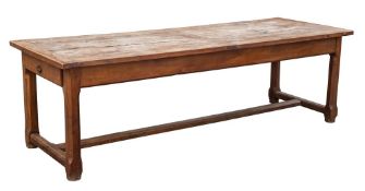 A French oak farmhouse table: made from French wine barrels:, with a rectangular cleated plank top,