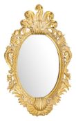 A contemporary carved giltwood oval mirror:,