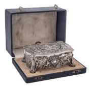 A Swiss silver plated automaton musical box: of serpentine outline decorated with putti in forest